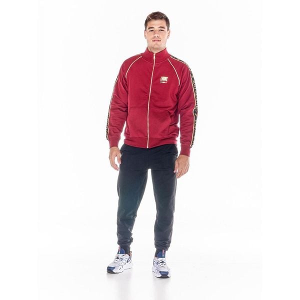 ZŁOTY męski dres ze stojącym kołnierzem i zamkiem błyskawicznym. Czerwone buty sportowe męskie LEONE 1947 APPAREL, z dresówki, bez zapięcia, na fitness i siłownię. W wyprzedaży za 223.60 zł.