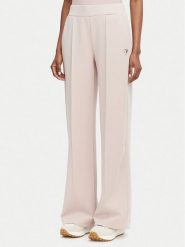 Guess Spodnie dresowe V6YB18 K4315 Różowy jasny Regular Fit. Czerwone spodnie dresowe damskie Guess, s, z aplikacjami, z dresówki. Za 394.99 zł.