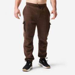 Spodnie fitness męskie Domyos. Brązowe spodnie sportowe męskie DOMYOS, l, bez wzorów, z materiału, na fitness i siłownię. Za 149.99 zł.