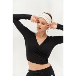 Top do jogi Moonholi Total Eclipse z długim rękawem. Czarne koszulki sportowe damskie MOONHOLI, s, bez wzorów, sportowe, bez kołnierzyka. Za 329.00 zł.