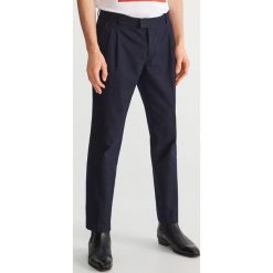 Eleganckie spodnie Heroes - Granatowy. Eleganckie spodnie męskie marki Reserved. Za 199.99 zł.