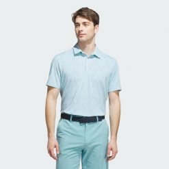 Koszulka Ultimate365 Mini Bunker Polo. Niebieskie buty sportowe męskie Adidas, bez zapięcia, na golfa. W wyprzedaży za 229.50 zł.