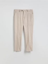 Spodnie regular fit z lnem - beżowy. Brązowe spodnie materiałowe męskie Reserved, l, bez wzorów, z bawełny. Za 149.99 zł.
