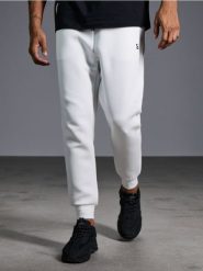 Spodnie tapered fit - biały. Białe spodnie materiałowe męskie Sinsay, l, bez wzorów, z dresówki, sportowe. Za 39.99 zł.