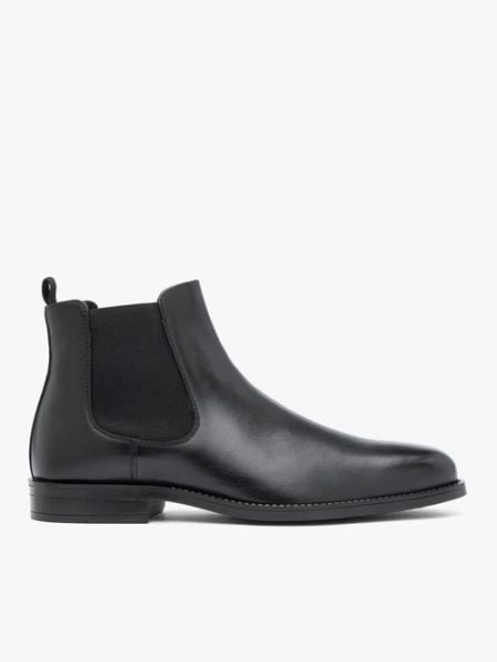 Czarne skórzane sztyblety. Czarne botki męskie Brawo sp. z o.o., bez wzorów, ze skóry, eleganckie, przed kolano, bez zapięcia. Za 599.99 zł.