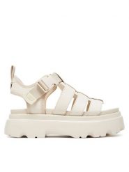 Ugg Sandały W Cora 1152698 Écru. Sandały damskie UGG, bez wzorów, z nubiku, bez obcasa, na płaskiej podeszwie, bez zapięcia. Za 509.99 zł.