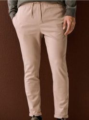 Spodnie dresowe jogger z domieszką wiskozy - beżowy. Brązowe spodnie sportowe męskie Sinsay, l, bez wzorów, z dresówki. Za 49.99 zł.
