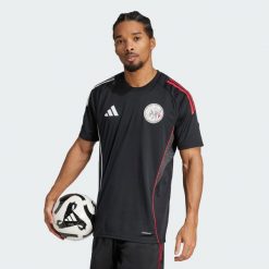Koszulka Ajax Amsterdam Tiro 25 Competition Training. Białe koszulki sportowe męskie Adidas, m, bez wzorów, bez kołnierzyka, bez ramiączek, do piłki nożnej. Za 311.96 zł.