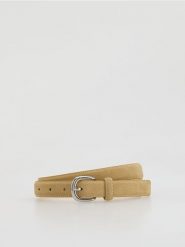 Skórzany pasek - jasnożółty. Żółte paski damskie Reserved, bez wzorów. Za 99.99 zł.