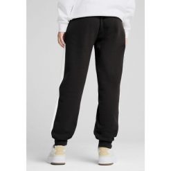 Damskie spodnie dresowe Around The Block PUMA Black. Czarne spodnie dresowe damskie Puma, xs, bez wzorów, z dresówki, trekkingowe. W wyprzedaży za 124.00 zł.