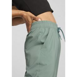 Damskie spodnie LACE PUMA Green Moon. Zielone spodnie sportowe damskie Puma, s, bez wzorów, na jogę i pilates. W wyprzedaży za 210.05 zł.