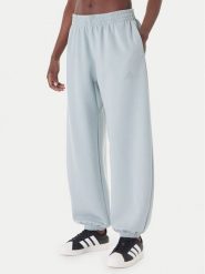 Adidas Spodnie dresowe Soft Lux KA7018 Zielony Loose Fit. Zielone spodnie dresowe damskie Adidas, m, bez wzorów, z dresówki. Za 329.99 zł.