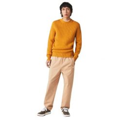 Spodnie turystyczne męskie Lacoste. Brązowe spodnie sportowe męskie Lacoste, na lato, l, z aplikacjami, z bawełny, trekkingowe. Za 357.00 zł.