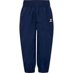 Wodoodporne spodnie dla dziewczynki Hummel Jupitor Tex Mini Softshell. Niebieskie spodnie sportowe dla dziewczynek Hummel, na lato, bez wzorów, z softshellu, trekkingowe. Za 270.50 zł.