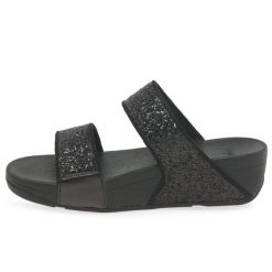 Kobiece klapki na koturnie FitFlop Lulu Slide. Czarne klapki damskie FIT FLOP, bez wzorów, bez obcasa, na koturnie. Za 484.50 zł.