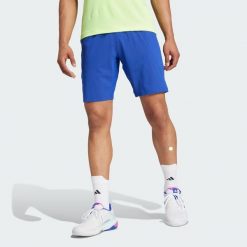 Szorty Tennis Ergo. Niebieskie krótkie spodenki sportowe męskie Adidas, s, bez wzorów, z elastanu, do biegania. Za 232.05 zł.