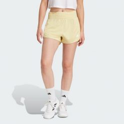 Szorty Pacer Essentials Knit High-Rise. Białe obuwie sportowe damskie Adidas, xl, bez wzorów, z materiału, sportowe, na fitness i siłownię. Za 126.30 zł.