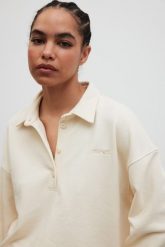 Bluza damska z kołnierzem w kolorze BUTTER YELLOW - EXPLORE-S/M. Żółte bluzy sportowe damskie Marsala, m, bez wzorów, z bawełny, bez kaptura. Za 339.90 zł.