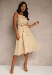 Beżowa Rozkloszowana Sukienka z Wiskozą w Paski Dolavessa. Brązowe sukienki damskie Renee, na co dzień, l, bez wzorów, z wiskozy, eleganckie, bez kołnierzyka, bez ramiączek, midi, kopertowe. Za 74.99 zł.