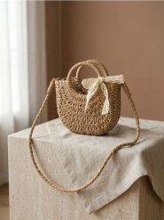 Pleciona torebka z ozdobną kokardą - beżowy. Brązowe torebki do ręki damskie Sinsay, bez wzorów, bez dodatków. Za 39.99 zł.