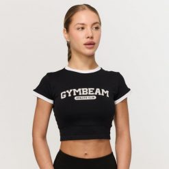 Koszulka damska fitness slim czarna Varsity. Czarne koszulki sportowe damskie GYMBEAM, xl, bez wzorów, z elastanu, klasyczne, bez kołnierzyka. Za 88.90 zł.