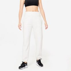 Spodnie dresowe damskie Domyos Gym & Pilates 500. Białe spodnie dresowe damskie DOMYOS, m, bez wzorów, z bawełny. W wyprzedaży za 79.99 zł.