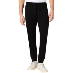 Spodnie męskie Champion Rib Cuff Pants - czarne, dopasowane, 100% bawełna. Czarne spodnie sportowe męskie Champion, m, bez wzorów, z bawełny. Za 130.99 zł.