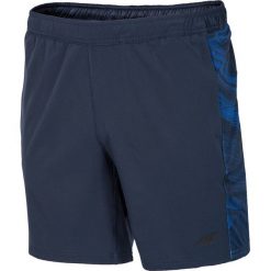 Spodenki treningowe męskie SKMF008 - granatowy ciemny. Niebieskie krótkie spodenki sportowe męskie 4f, z materiału. W wyprzedaży za 89.99 zł.