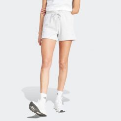 Spodenki fitness damskie ADIDAS. Fioletowe obuwie sportowe damskie Adidas, l, bez wzorów, z bawełny, sportowe, na fitness i siłownię. W wyprzedaży za 99.99 zł.