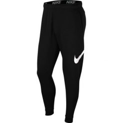 Spodnie treningowe damskie Nike Taper. Czarne spodnie sportowe damskie Nike, s, bez wzorów, z materiału, na fitness i siłownię, dri-fit (nike). Za 219.80 zł.