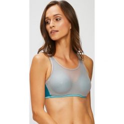 Triumph - Biustonosz Triaction Magic Motion. Brązowe biustonosze Triumph, z haftami, z dzianiny. W wyprzedaży za 159.90 zł.
