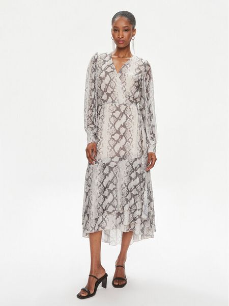 Bruuns Bazaar Sukienka codzienna Nora BBW3497 Beżowy Relaxed Fit. Brązowe sukienki damskie Bruuns Bazaar, na co dzień, bez wzorów, z syntetyku, bez kołnierzyka, bez ramiączek, proste. Za 379.99 zł.