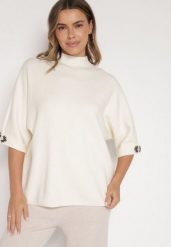 Jasnobeżowy Sweter Ozdobiony na Rękawach Cyrkoniami Aletusa. Brązowe swetry damskie Born2be, z aplikacjami, z jeansu, eleganckie, bez kołnierzyka, bez ramiączek, bez kaptura. Za 99.99 zł.