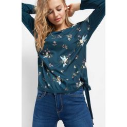 Koszulka w kwiaty z wiązaniem. T-shirty damskie marki Orsay. W wyprzedaży za 55.00 zł.