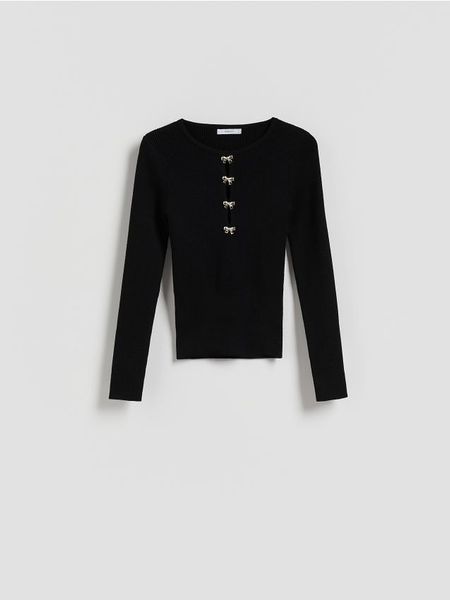 Bluzka z ozdobną aplikacją - czarny. Czarne bluzki damskie Reserved, l, z aplikacjami, z dzianiny, bez kołnierzyka, bez ramiączek. Za 99.99 zł.