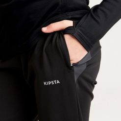 Spodnie do piłki nożnej dla dziewczynek Kipsta Viralto. Niebieskie spodnie sportowe dla dziewczynek KIPSTA, bez wzorów, z elastanu, na fitness i siłownię. W wyprzedaży za 49.99 zł.