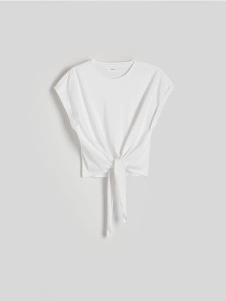 T-shirt z wiązaniem - biały. Białe bluzki damskie Reserved, l, bez wzorów, z bawełny, bez kołnierzyka. W wyprzedaży za 29.99 zł.