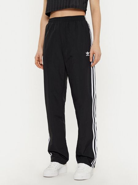Adidas Spodnie dresowe Woven JD5335 Czarny Loose Fit. Czarne spodnie dresowe damskie Adidas, s, bez wzorów, z dresówki. Za 239.99 zł.
