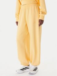 Adidas Spodnie dresowe Soft Lux KA7020 Pomarańczowy Loose Fit. Brązowe spodnie dresowe damskie Adidas, m, bez wzorów, z dresówki. Za 229.99 zł.