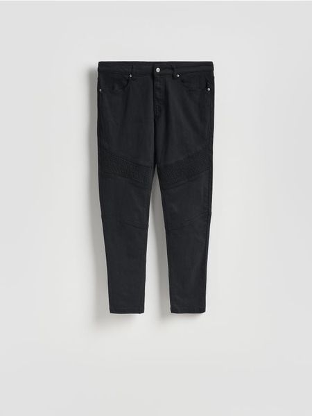 Bawełniane spodnie skinny - czarny. Czarne spodnie materiałowe męskie Reserved, l, bez wzorów, z bawełny. Za 149.99 zł.