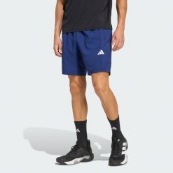 Tkane Szorty Do Ćwiczeń Essentials Base. Niebieskie krótkie spodenki sportowe męskie Adidas, bez wzorów, na fitness i siłownię, climacool (adidas). Za 119.00 zł.