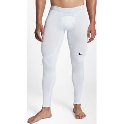 Nike Spodnie męskie M NP Tight białe r. S (838067 100). Spodnie materiałowe męskie marki Nike. Za 118.38 zł.