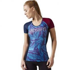Koszulka treningowa damska Reebok Compression. Niebieskie koszulki sportowe damskie Reebok, l, bez wzorów, z materiału, eleganckie, bez kołnierzyka. Za 308.00 zł.