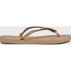 Havaianas - Japonki. Żółte klapki damskie Havaianas, bez wzorów, z materiału, bez obcasa, bez zapięcia. W wyprzedaży za 89.90 zł.