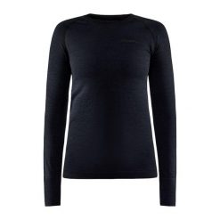 Damska koszulka kompresyjna z długim rękawem Craft Core Dry Active Comfort. Czarne koszulki sportowe damskie Craft, xl, bez wzorów, z materiału, bez kołnierzyka, bez ramiączek, na fitness i siłownię. Za 336.95 zł.
