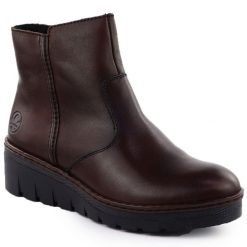 Skórzane botki damskie na koturnie brązowe Rieker X9165-27. Brązowe botki damskie Rieker, ze skóry, bez obcasa, na koturnie, bez zapięcia. Za 419.00 zł.