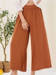 Wiskozowe spodnie culotte - żółty. Żółte spodnie materiałowe damskie Sinsay, l, bez wzorów, z wiskozy. Za 35.99 zł.