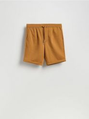 Szorty regular fit - bursztynowy. Pomarańczowe szorty męskie Reserved, l, bez wzorów, z dzianiny. Za 99.99 zł.