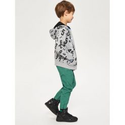 Bawełniane spodnie jogger - Zielony. Zielone spodnie materiałowe dla chłopców Reserved, m, bez wzorów, z bawełny. Za 129.99 zł.