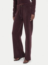 Juicy Couture Spodnie dresowe JCWEB006 Bordowy Regular Fit. Czerwone spodnie dresowe damskie Juicy Couture, xxs, bez wzorów, z dresówki. Za 549.99 zł.